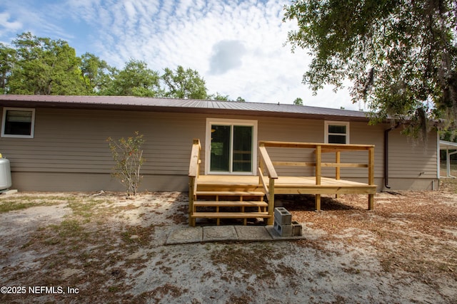 7013 Elfo Rd, Keystone Heights, FL 32656 - back of property with a deck and metal roof