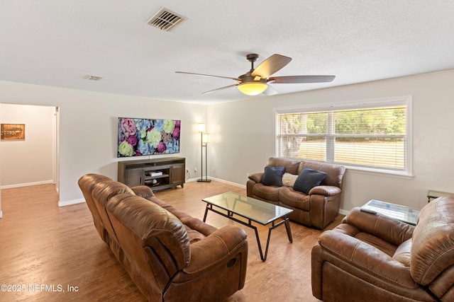 7013 Elfo Rd, Keystone Heights, FL 32656 - living room featuring ceiling fan, baseboards, and light wood finished floors