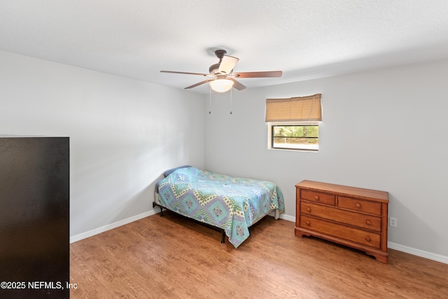 7013 Elfo Rd, Keystone Heights, FL 32656 - bedroom featuring wood finished floors, baseboards, and ceiling fan