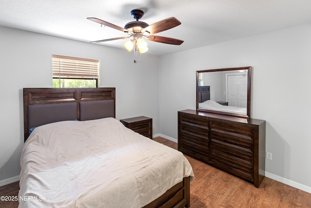 7013 Elfo Rd, Keystone Heights, FL 32656 - bedroom featuring wood finished floors, baseboards, and a ceiling fan