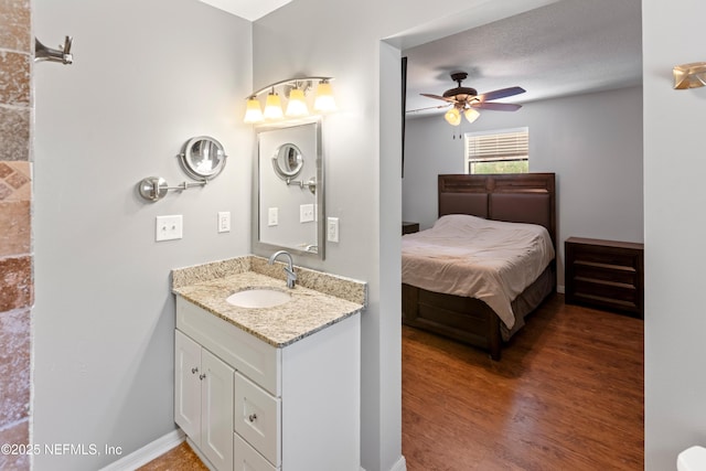7013 Elfo Rd, Keystone Heights, FL 32656 - bathroom featuring a ceiling fan, vanity, and wood finished floors