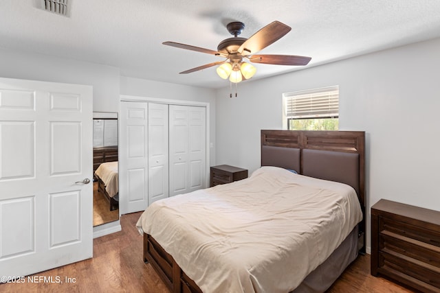 7013 Elfo Rd, Keystone Heights, FL 32656 - bedroom featuring a closet, wood finished floors, and ceiling fan