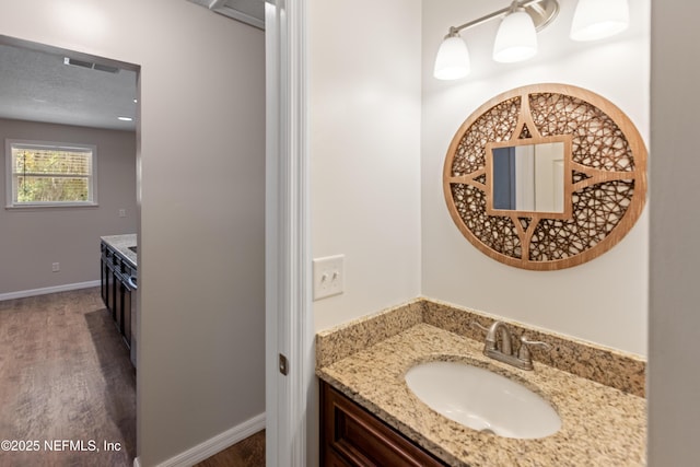 7013 Elfo Rd, Keystone Heights, FL 32656 - bathroom featuring vanity and wood finished floors