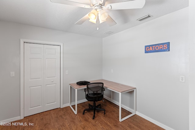 7013 Elfo Rd, Keystone Heights, FL 32656 - unfurnished office with wood finished floors, ceiling fan, and baseboards