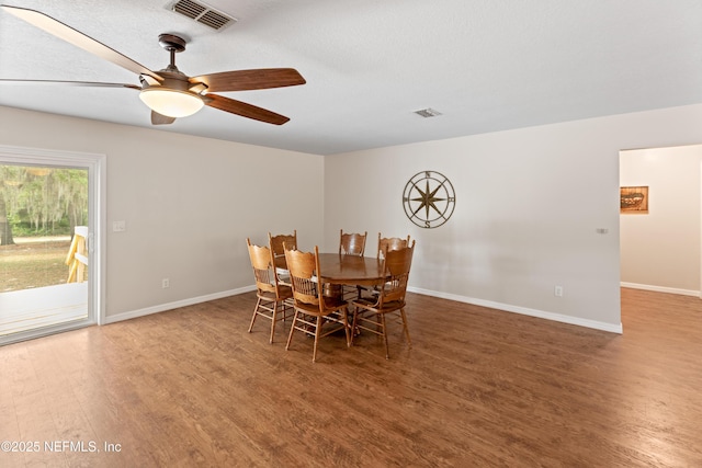 7013 Elfo Rd, Keystone Heights, FL 32656 - dining area with wood finished floors, baseboards, and a ceiling fan