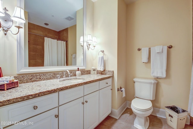 2358 Riverside Ave Unit 304, Jacksonville, FL 32204 - bathroom with vanity, toilet, tile patterned floors, baseboards, and curtained shower