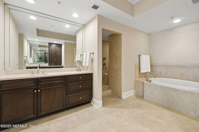 2358 Riverside Ave Unit 304, Jacksonville, FL 32204 - full bath with a garden tub, vanity, tile patterned flooring, a tile shower, and recessed lighting