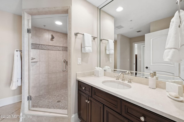 2358 Riverside Ave Unit 304, Jacksonville, FL 32204 - bathroom with baseboards, a shower stall, vanity, tile patterned floors, and recessed lighting