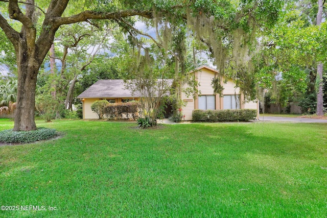 11711 Sparkleberry Ln, Jacksonville, FL 32223 - view of front of property with a front yard, driveway, and a garage