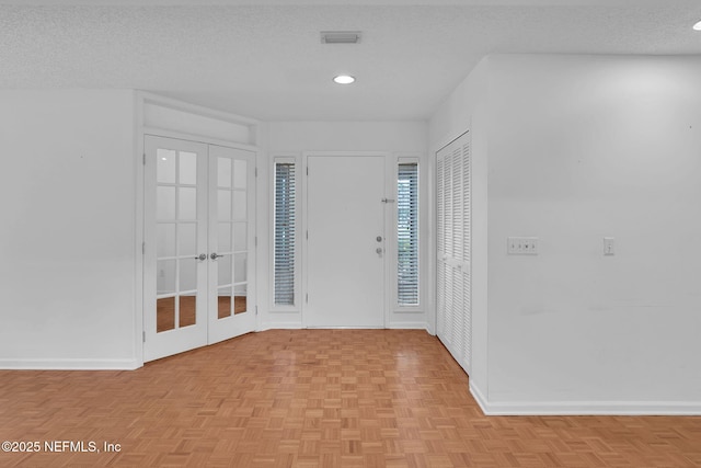 11711 Sparkleberry Ln, Jacksonville, FL 32223 - entryway featuring french doors, baseboards, and recessed lighting
