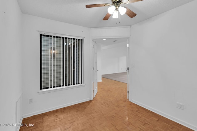 11711 Sparkleberry Ln, Jacksonville, FL 32223 - spare room featuring a ceiling fan, baseboards, and a textured ceiling