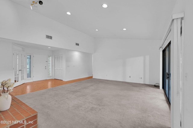 11711 Sparkleberry Ln, Jacksonville, FL 32223 - unfurnished living room with recessed lighting, vaulted ceiling, and carpet