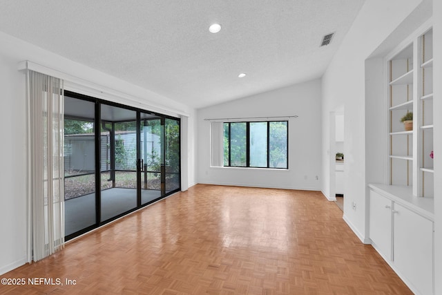 11711 Sparkleberry Ln, Jacksonville, FL 32223 - empty room with a textured ceiling, vaulted ceiling, recessed lighting, and baseboards