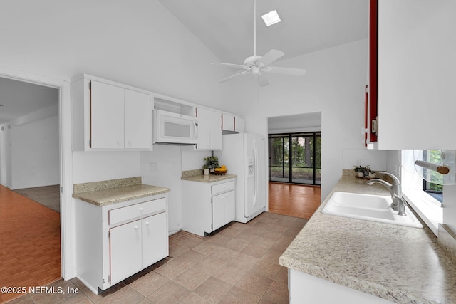 11711 Sparkleberry Ln, Jacksonville, FL 32223 - kitchen with a sink, white appliances, high vaulted ceiling, ceiling fan, and light countertops