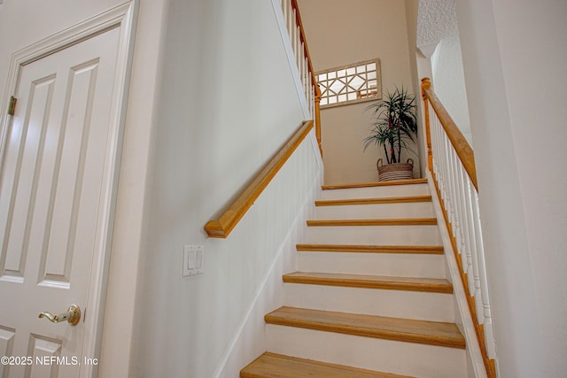 9155 June Ln, Saint Augustine Beach, FL 32080 - staircase with a towering ceiling