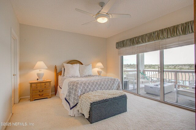 9155 June Ln, Saint Augustine Beach, FL 32080 - carpeted bedroom featuring access to outside, baseboards, ceiling fan, and a water view