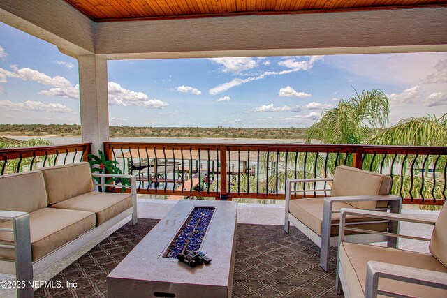 9155 June Ln, Saint Augustine Beach, FL 32080 - wooden deck featuring an outdoor living space with a fire pit