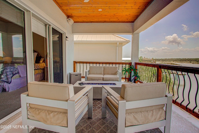 9155 June Ln, Saint Augustine Beach, FL 32080 - balcony with an outdoor living space with a fire pit