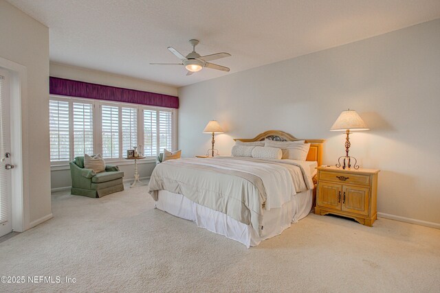 9155 June Ln, Saint Augustine Beach, FL 32080 - bedroom with light colored carpet, baseboards, and a ceiling fan