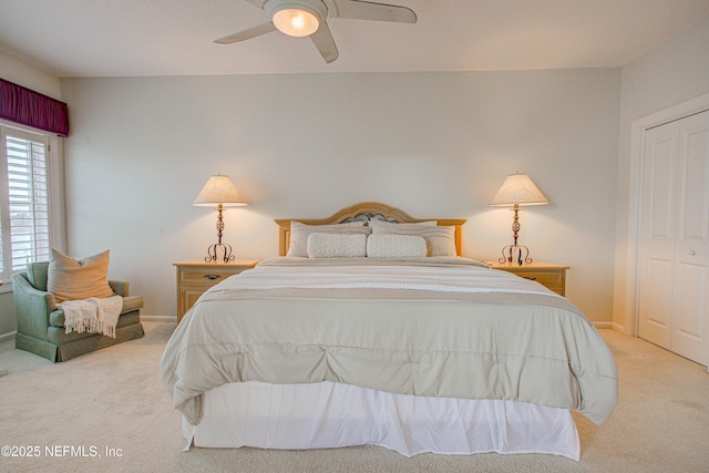 9155 June Ln, Saint Augustine Beach, FL 32080 - bedroom featuring light colored carpet, baseboards, ceiling fan, and a closet