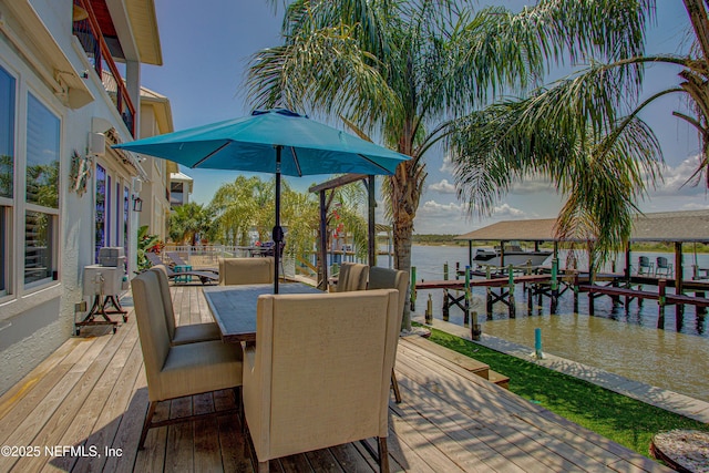 9155 June Ln, Saint Augustine Beach, FL 32080 - wooden deck featuring a water view, a boat dock, and outdoor dining area