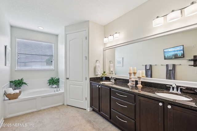 1466 Oldenburg Dr, Jacksonville, FL 32218 - bathroom featuring a garden tub, double vanity, and tile patterned flooring