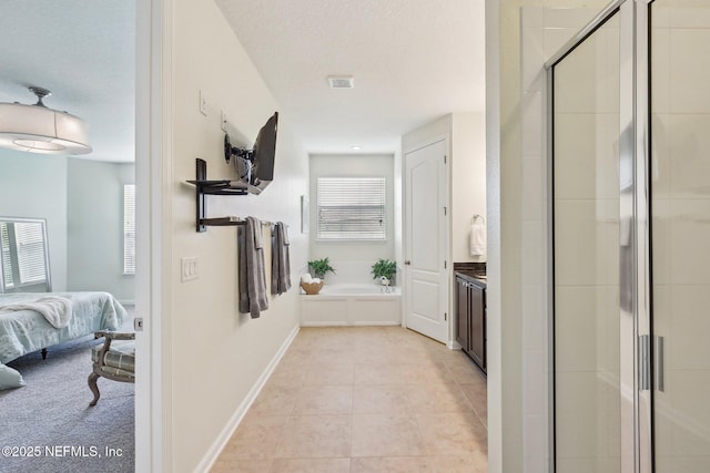1466 Oldenburg Dr, Jacksonville, FL 32218 - hall featuring light tile patterned floors, a textured ceiling, and baseboards