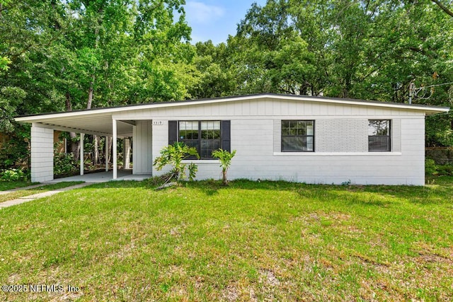 single story home with a carport and a front lawn