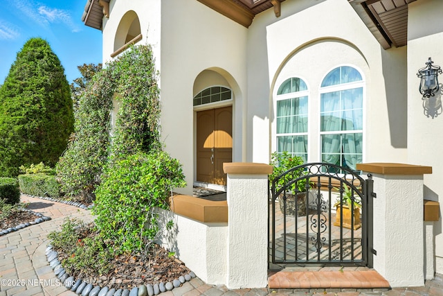 2919 Brettungar Dr, Jacksonville, FL 32224 - entrance to property featuring stucco siding and a gate