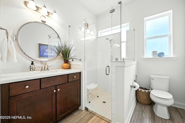 2919 Brettungar Dr, Jacksonville, FL 32224 - full bath featuring plenty of natural light, vanity, a stall shower, and wood tiled floors
