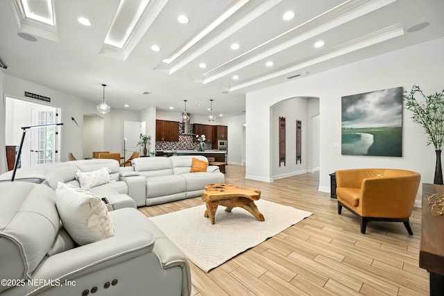2919 Brettungar Dr, Jacksonville, FL 32224 - living area with arched walkways, recessed lighting, and light wood-type flooring