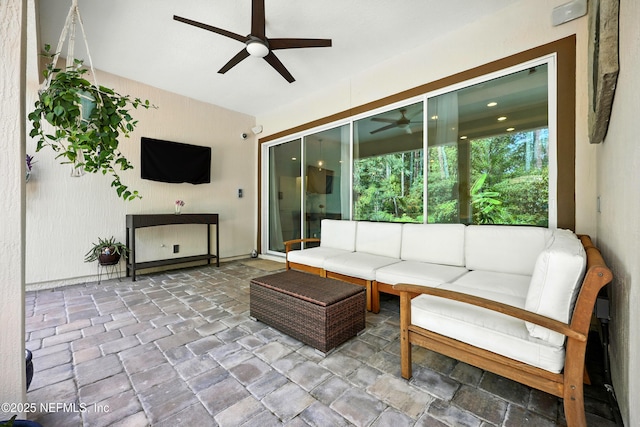 2919 Brettungar Dr, Jacksonville, FL 32224 - living area with a ceiling fan and stone tile floors