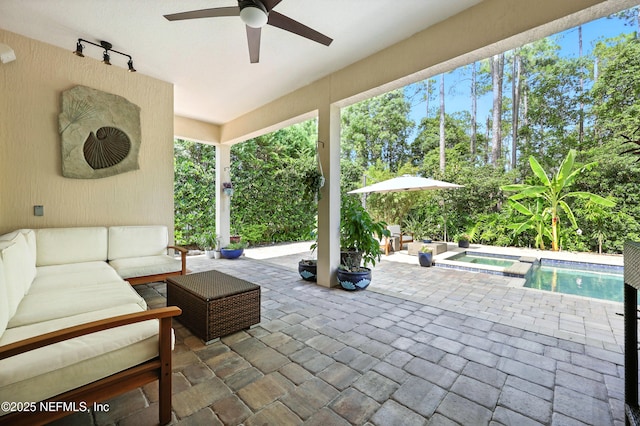 2919 Brettungar Dr, Jacksonville, FL 32224 - view of patio / terrace with outdoor lounge area, a ceiling fan, view of wooded area, and a pool with connected hot tub