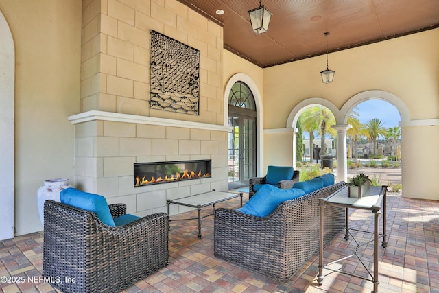 2919 Brettungar Dr, Jacksonville, FL 32224 - view of patio / terrace with an outdoor living space with a fireplace