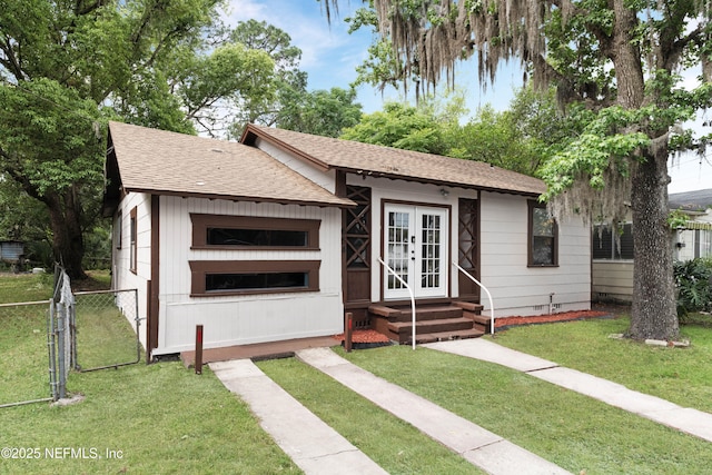 654 Woodbine St, Jacksonville, FL 32206 - view of front of home featuring crawl space, roof with shingles, a gate, and french doors