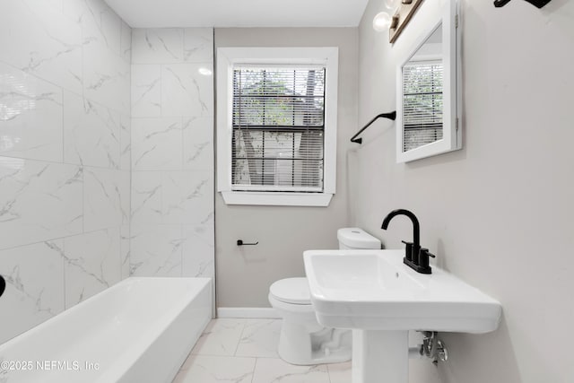 654 Woodbine St, Jacksonville, FL 32206 - full bathroom with marble finish floors, toilet, and baseboards