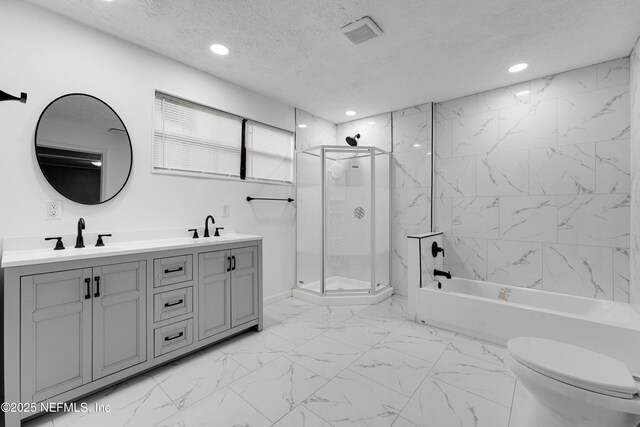 654 Woodbine St, Jacksonville, FL 32206 - full bath featuring an enclosed shower, marble finish floors, a textured ceiling, a tub, and double vanity
