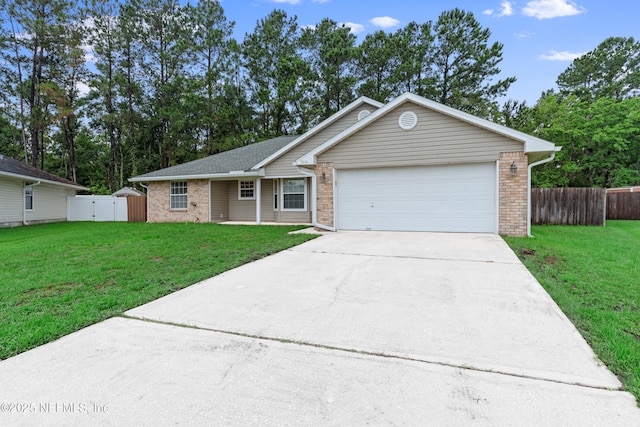 2830 Limestone Ct, Middleburg, FL 32068 - ranch-style house with driveway, a garage, a gate, and brick siding