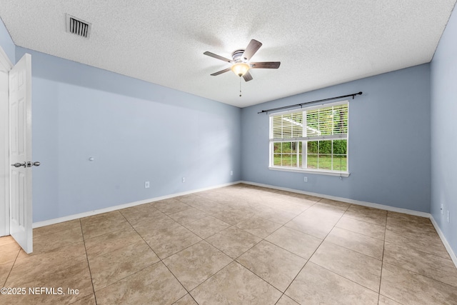 2830 Limestone Ct, Middleburg, FL 32068 - unfurnished room featuring a ceiling fan, a textured ceiling, tile patterned flooring, and baseboards