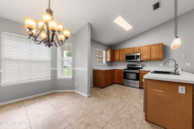 2830 Limestone Ct, Middleburg, FL 32068 - kitchen with appliances with stainless steel finishes, a sink, lofted ceiling, light countertops, and a chandelier