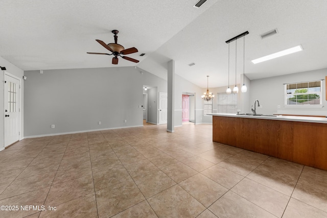 2830 Limestone Ct, Middleburg, FL 32068 - unfurnished living room with lofted ceiling, a ceiling fan, a chandelier, light tile patterned flooring, and a sink