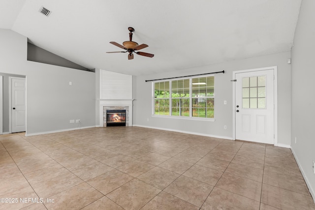 2830 Limestone Ct, Middleburg, FL 32068 - unfurnished living room with light tile patterned flooring, a ceiling fan, lofted ceiling, a fireplace, and baseboards