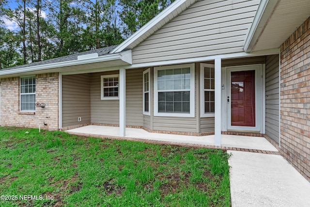 2830 Limestone Ct, Middleburg, FL 32068 - doorway to property with brick siding and a lawn