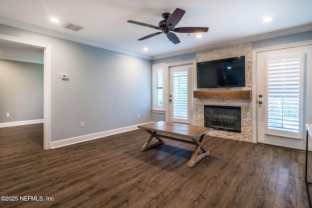 100 Fairway Park Blvd Unit 1306, Ponte Vedra Beach, FL 32082 - living area with dark wood-style floors, a fireplace, crown molding, a ceiling fan, and baseboards