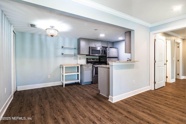 100 Fairway Park Blvd Unit 1306, Ponte Vedra Beach, FL 32082 - kitchen with stainless steel appliances, gray cabinets, dark wood finished floors, decorative backsplash, and ornamental molding