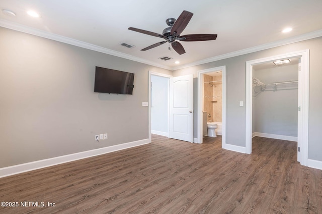 100 Fairway Park Blvd Unit 1306, Ponte Vedra Beach, FL 32082 - unfurnished bedroom featuring baseboards, wood finished floors, a spacious closet, ornamental molding, and a closet
