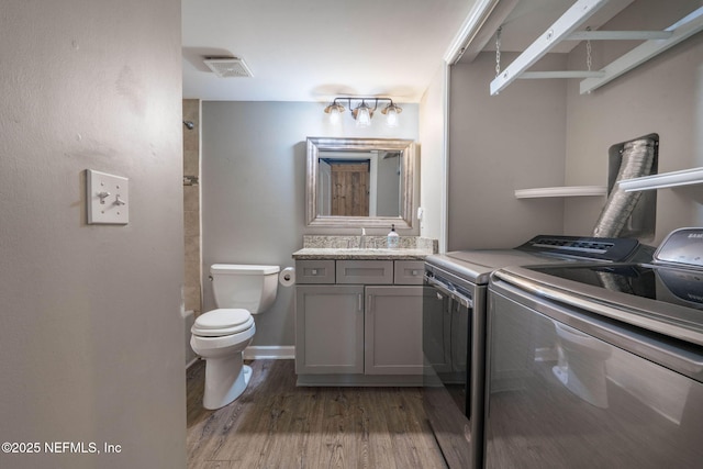 100 Fairway Park Blvd Unit 1306, Ponte Vedra Beach, FL 32082 - laundry room featuring washing machine and clothes dryer and light wood-style floors