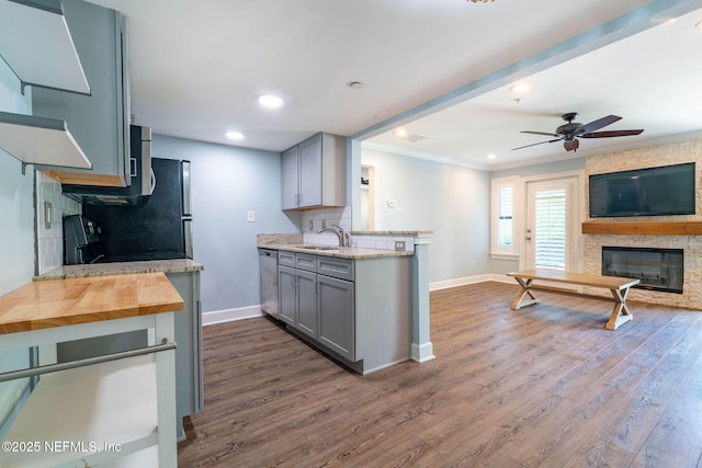 100 Fairway Park Blvd Unit 1306, Ponte Vedra Beach, FL 32082 - kitchen with gray cabinetry, a fireplace, open floor plan, crown molding, and stainless steel dishwasher