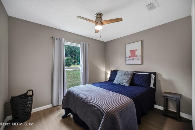 1573 Aletha Dr, Jacksonville, FL 32211 - bedroom with wood finished floors, baseboards, and a ceiling fan