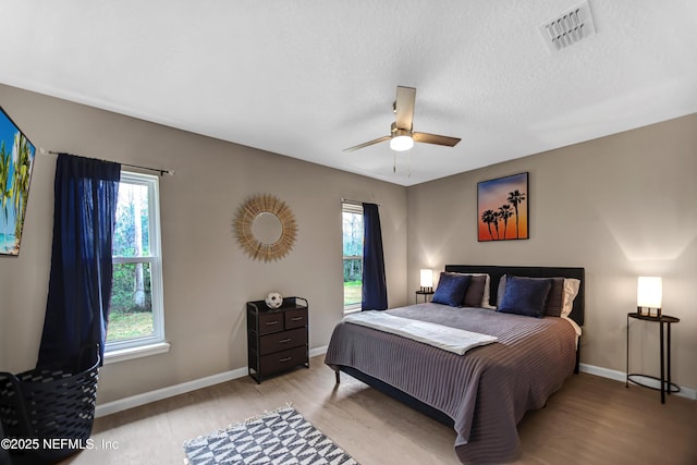 1573 Aletha Dr, Jacksonville, FL 32211 - bedroom featuring light wood-style floors, multiple windows, and baseboards